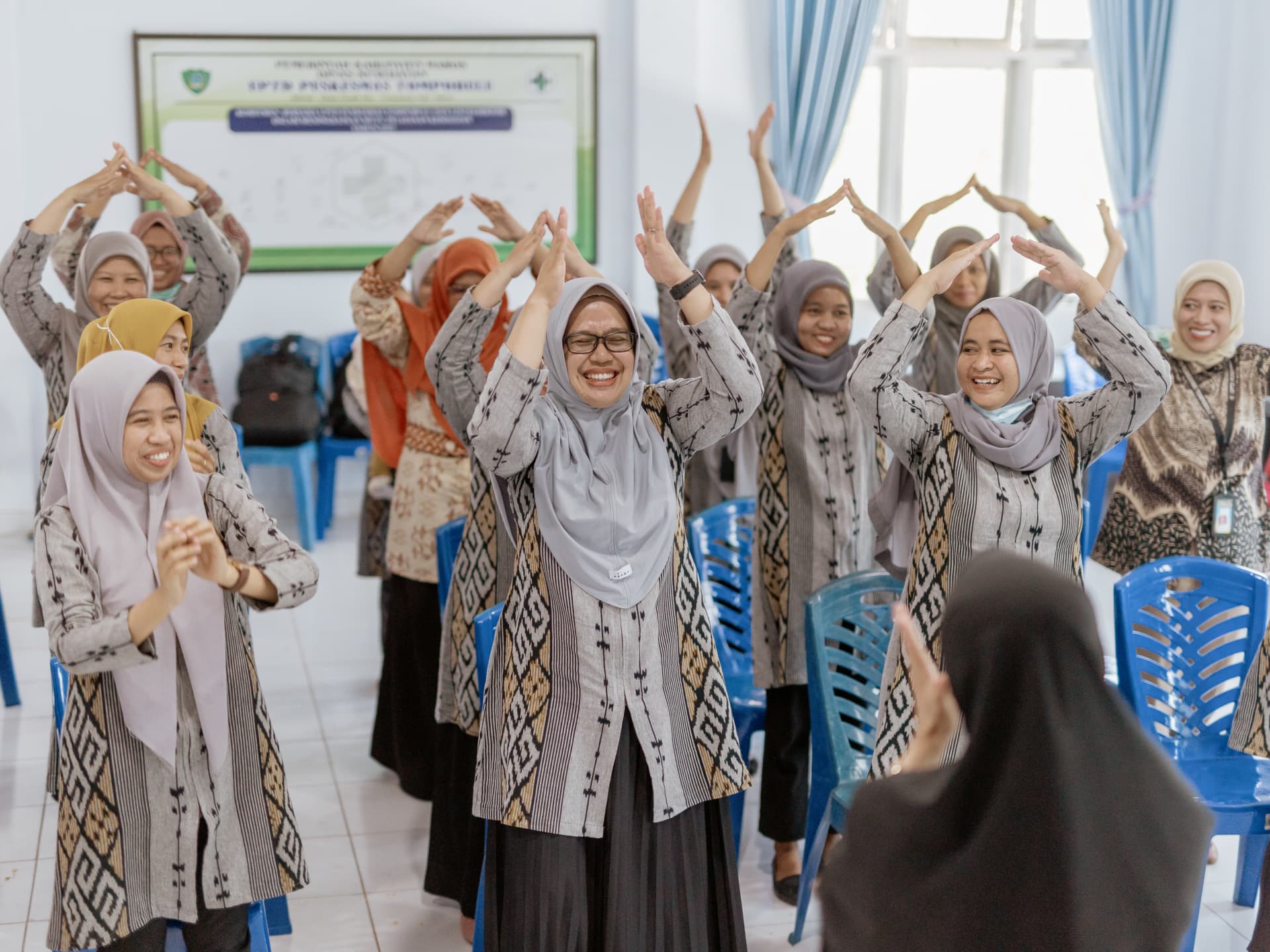 Healthcare workers participating in a training session on nutrition and maternal and child health.