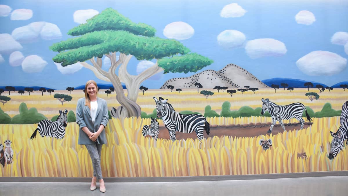 Taylor Smith with Zebras mural painting
