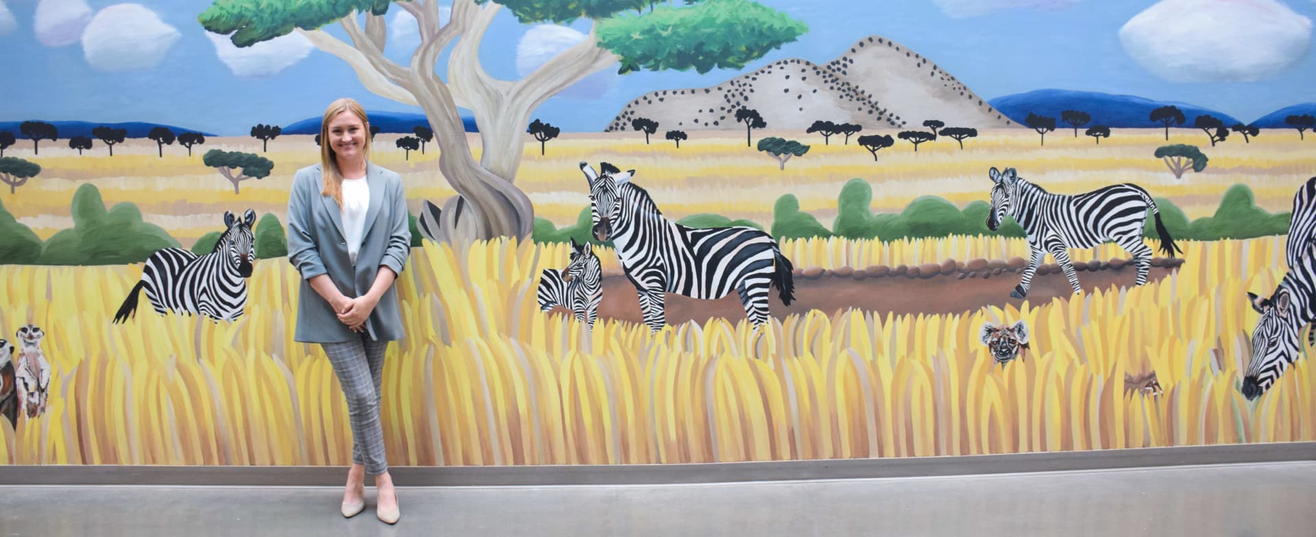 Taylor Smith with Zebras mural painting