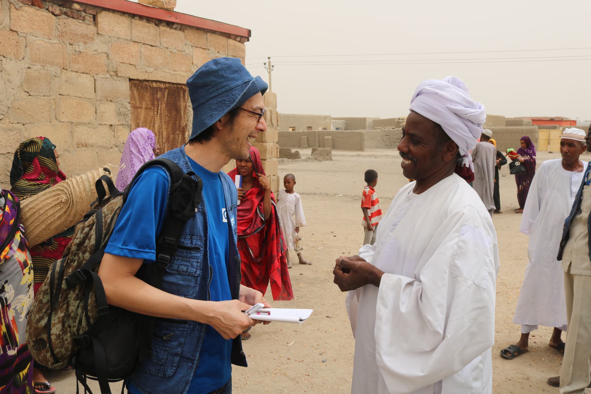 Hiroaki Umano of Plan International, on the left, working in Sudan