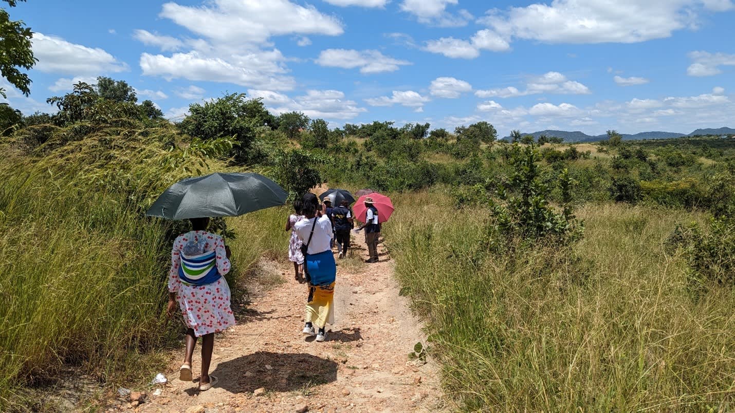 Mothers and the research team go on a community walkabout to discuss the environment