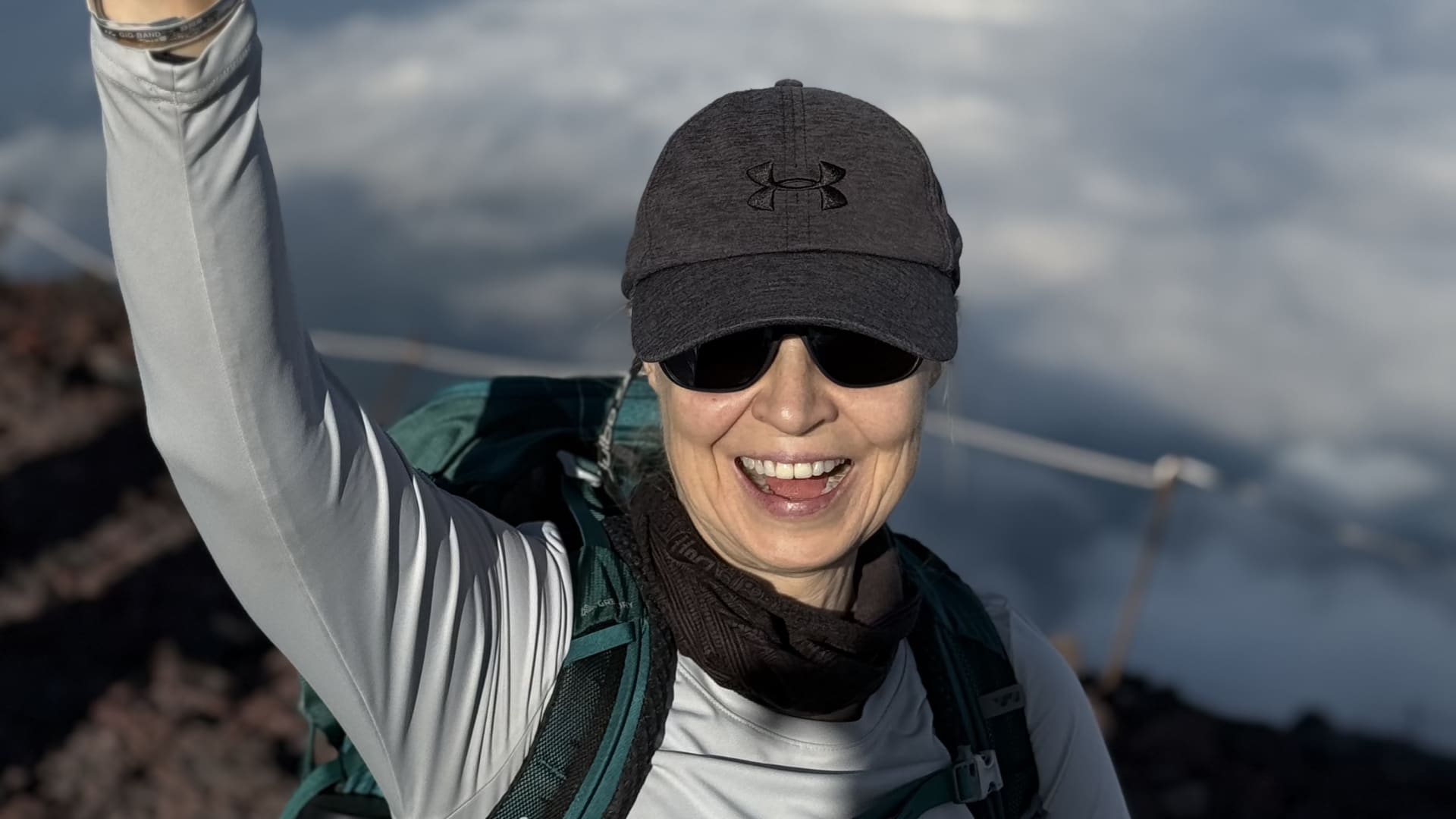 Woman posing for picture while hiking