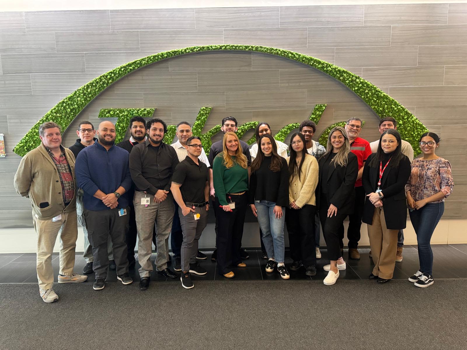 Hillary Ferrer, Takeda’s head of lab planning and logistics (center, green shirt), with Takeda and Boston Lab Services employees