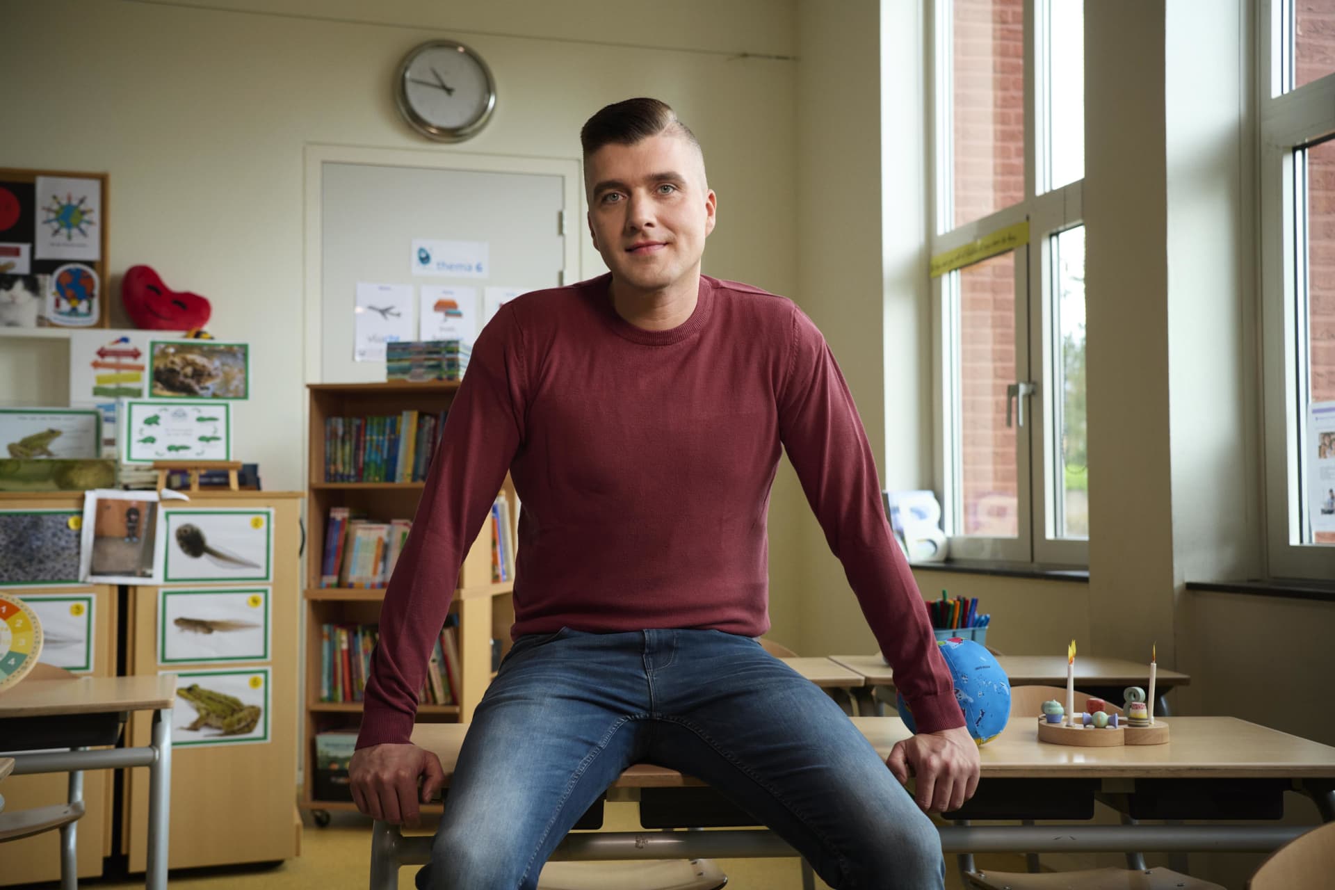 A person sitting on a desk