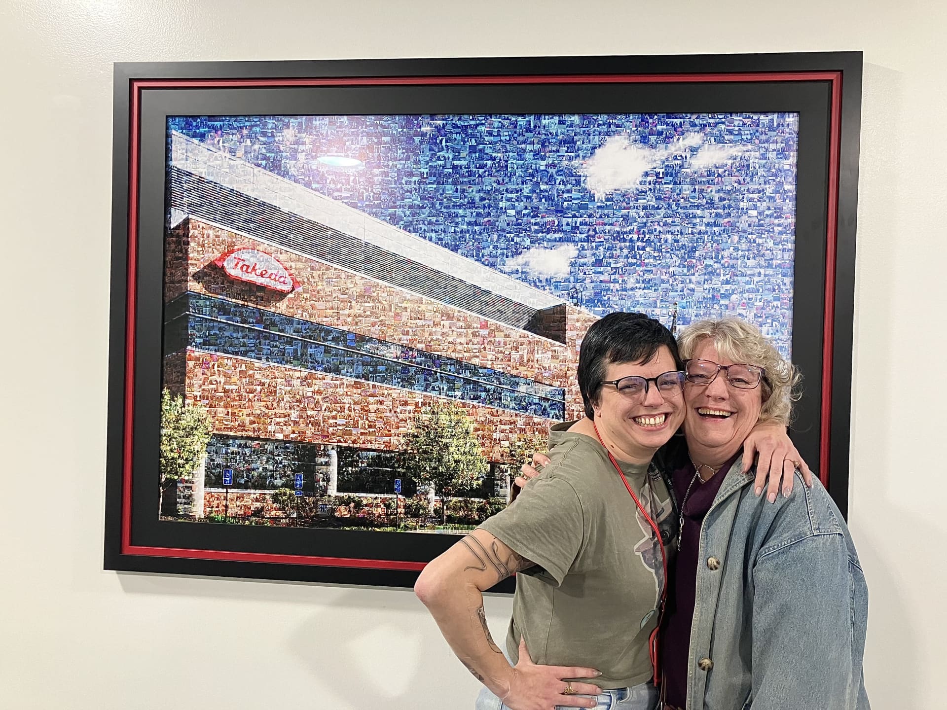 Jennina and her mom in front of the mural at Brooklyn Park family day