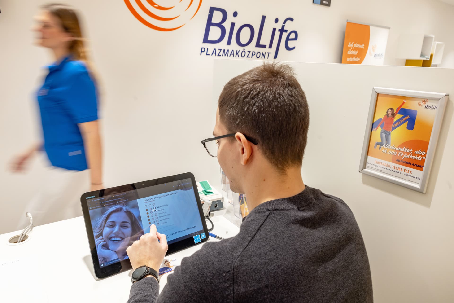 Person interacting with tablet in biolife facility