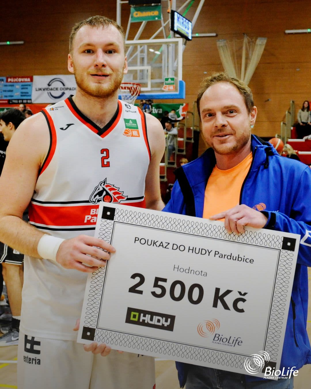 Radim and basketball player with award