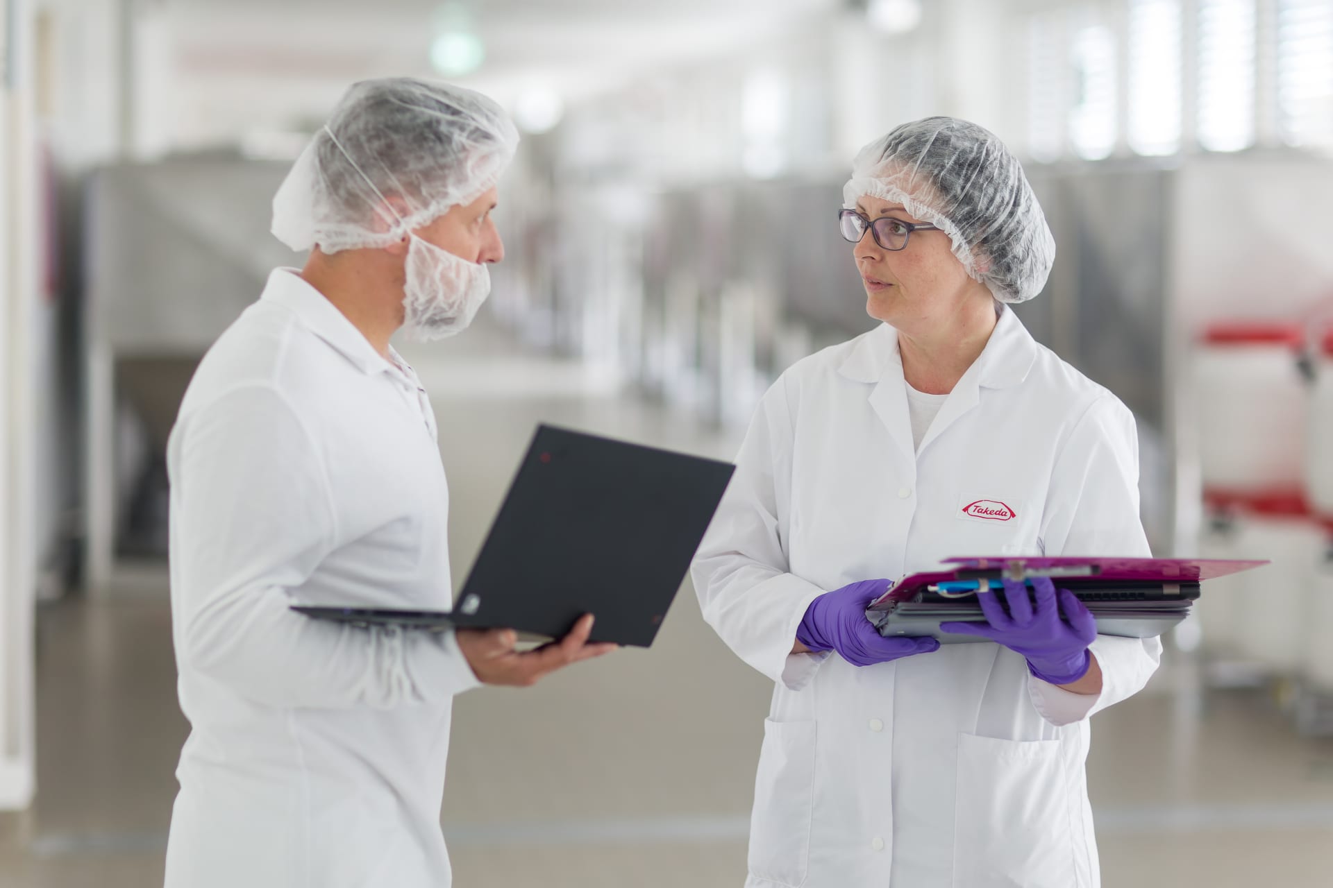 Two lab professionals