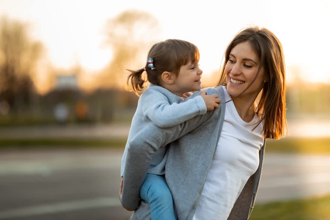 A person carrying a child