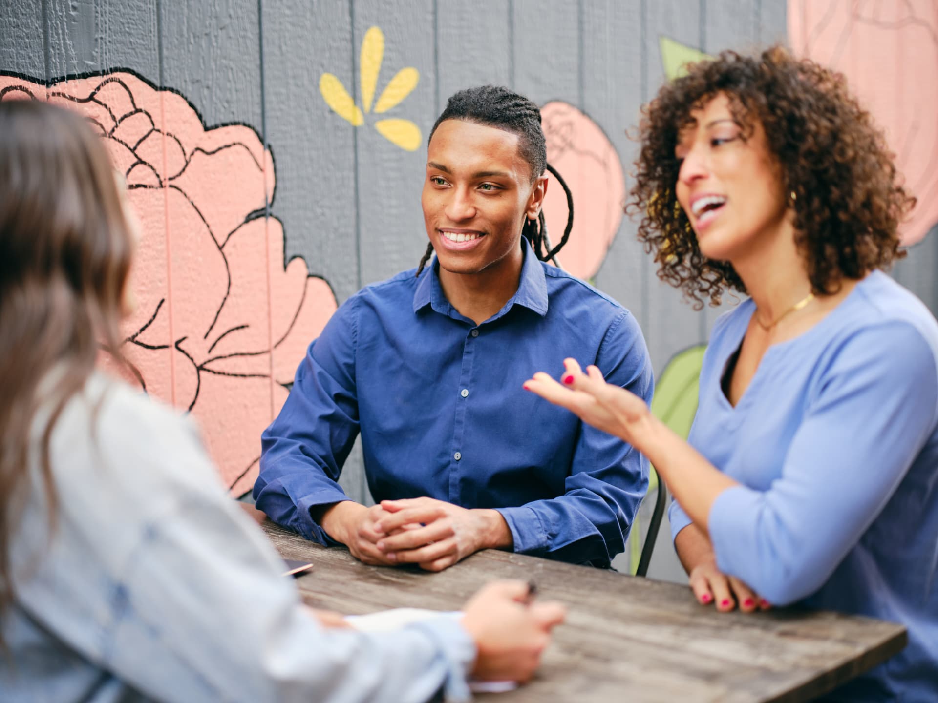 People talking sitting in a bench