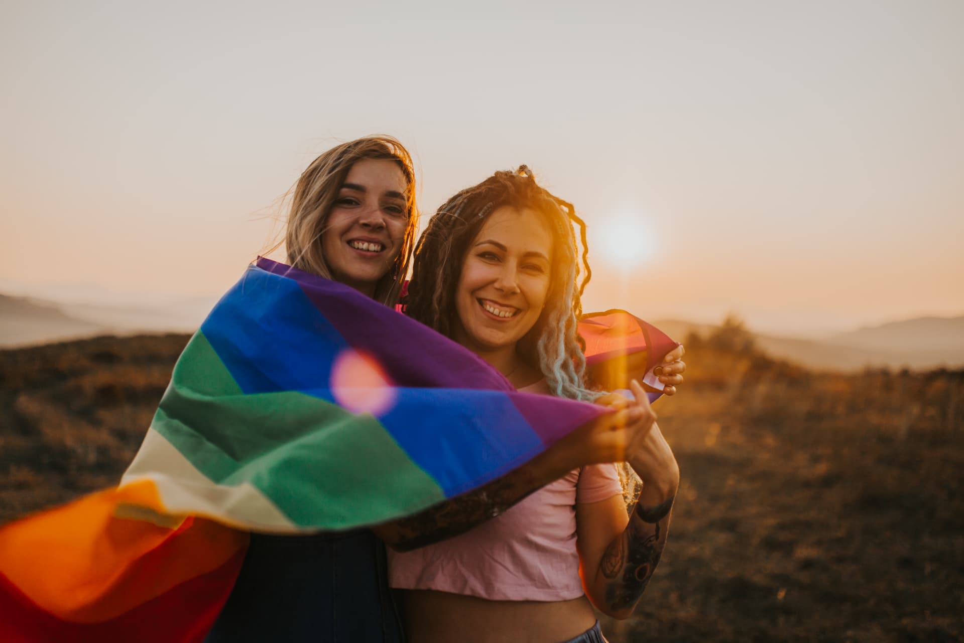 Two women holding a flag
