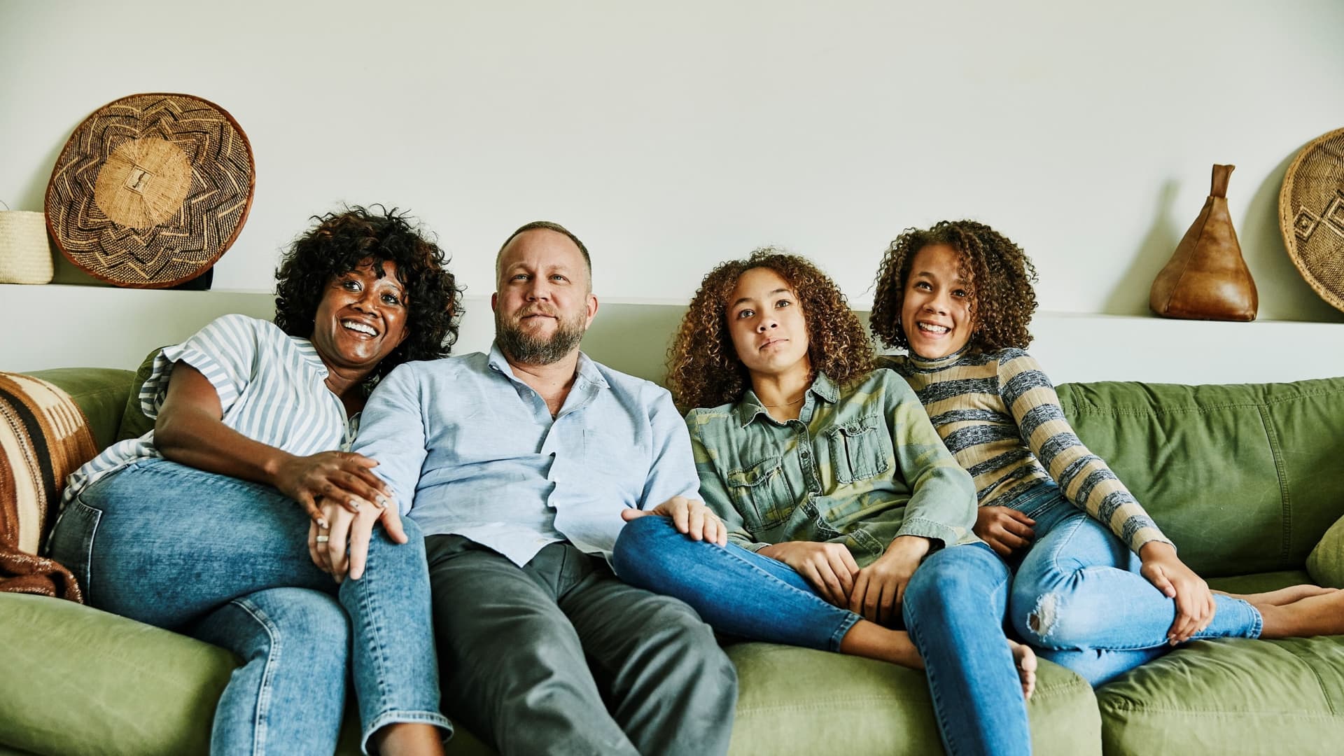 Family sitting on couch