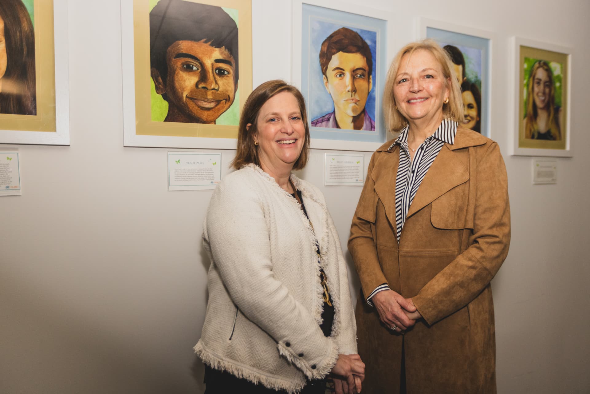 A couple of women standing next to each other