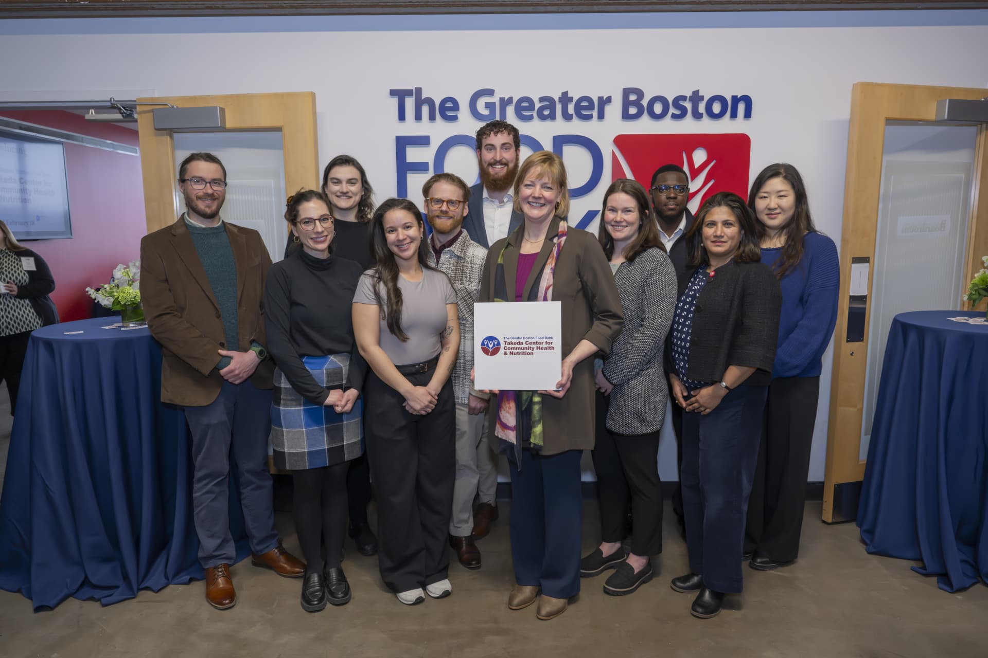 Michele Fronk Schuckel with GBFB members at the GBFB Takeda Center announcement.