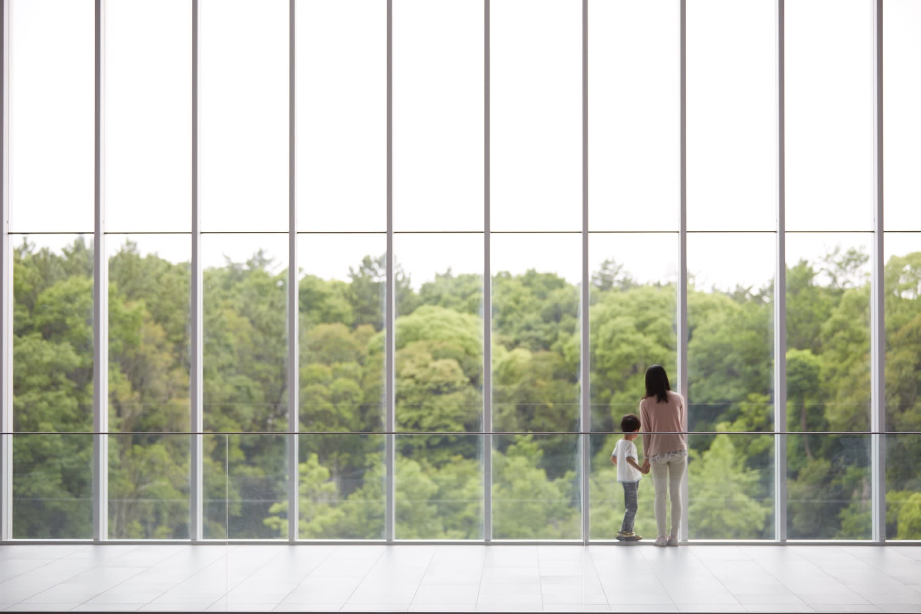 woman and kid looking out the window