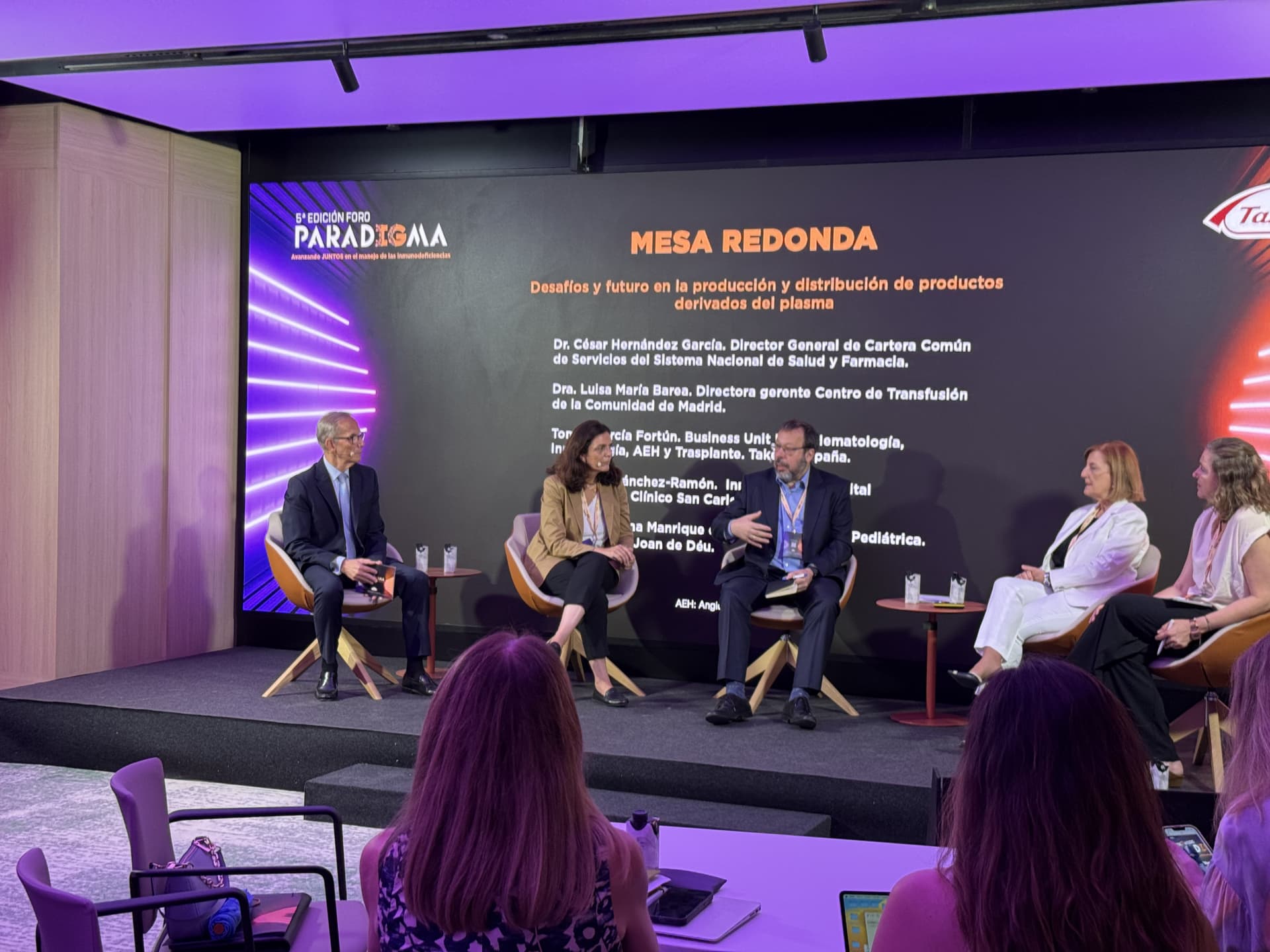 Picture of people talking on a stage