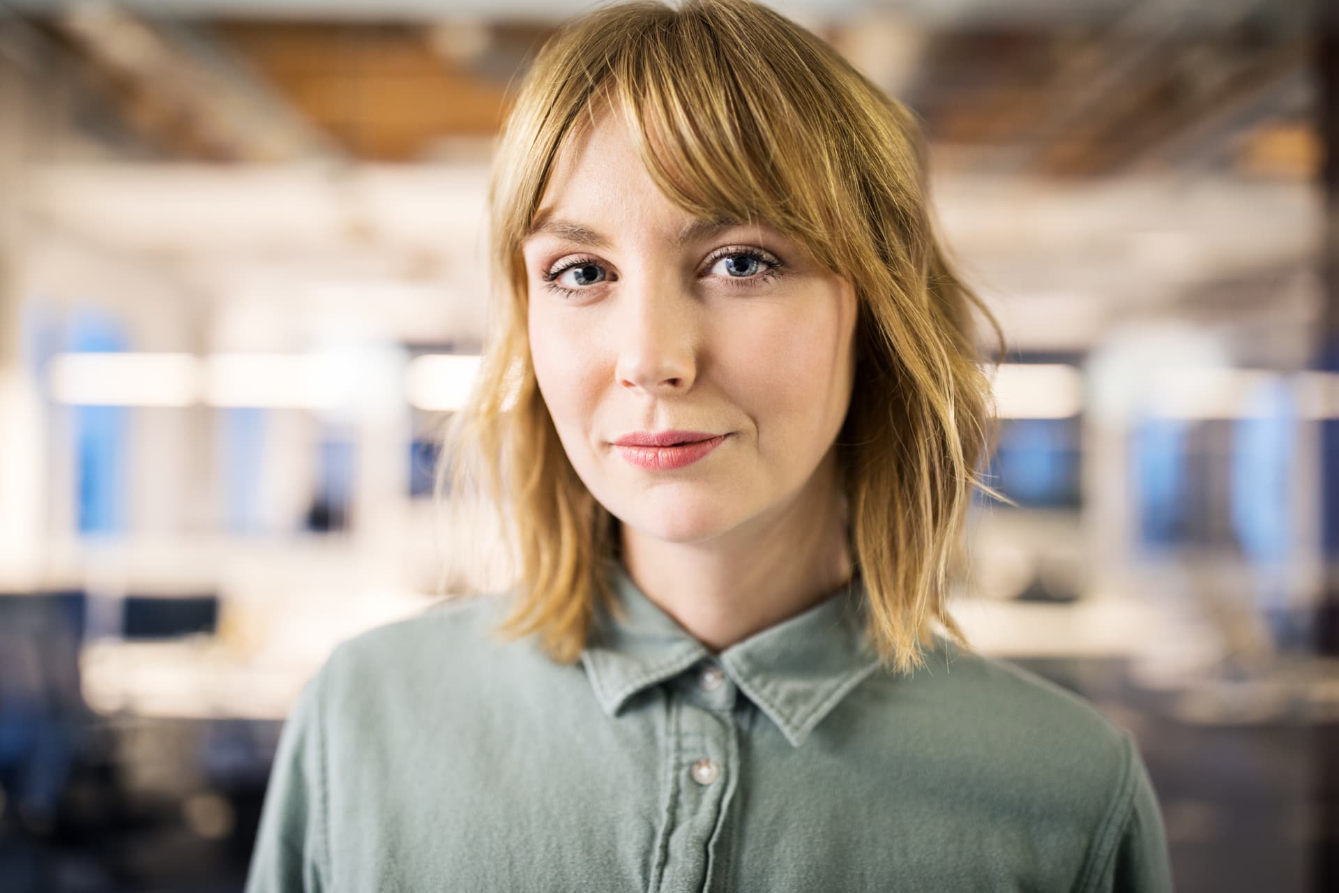 Headshot of a woman with a green shirt