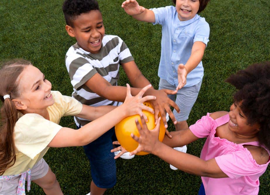 A group of kids playing with a ball