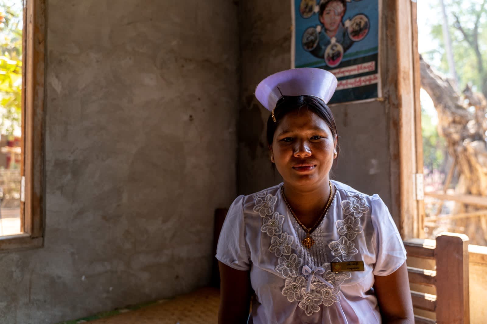 Woman with local garment looking at camera for picture