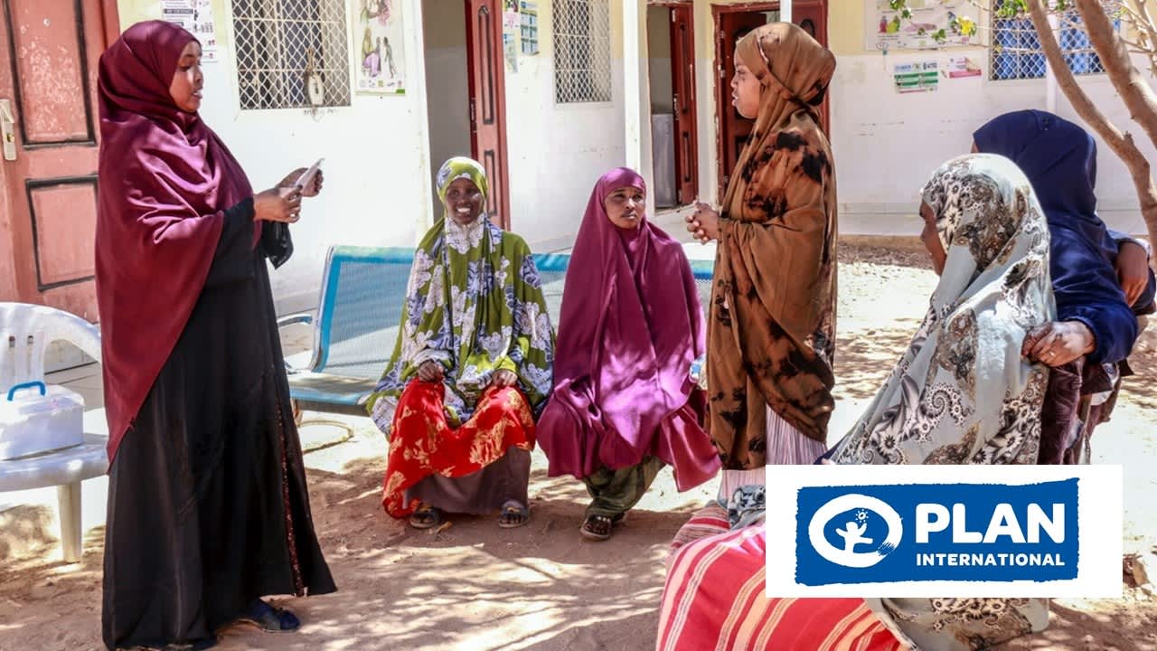 Group of six women discussing