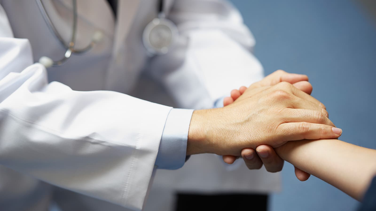 A doctor grabbing someone's hand