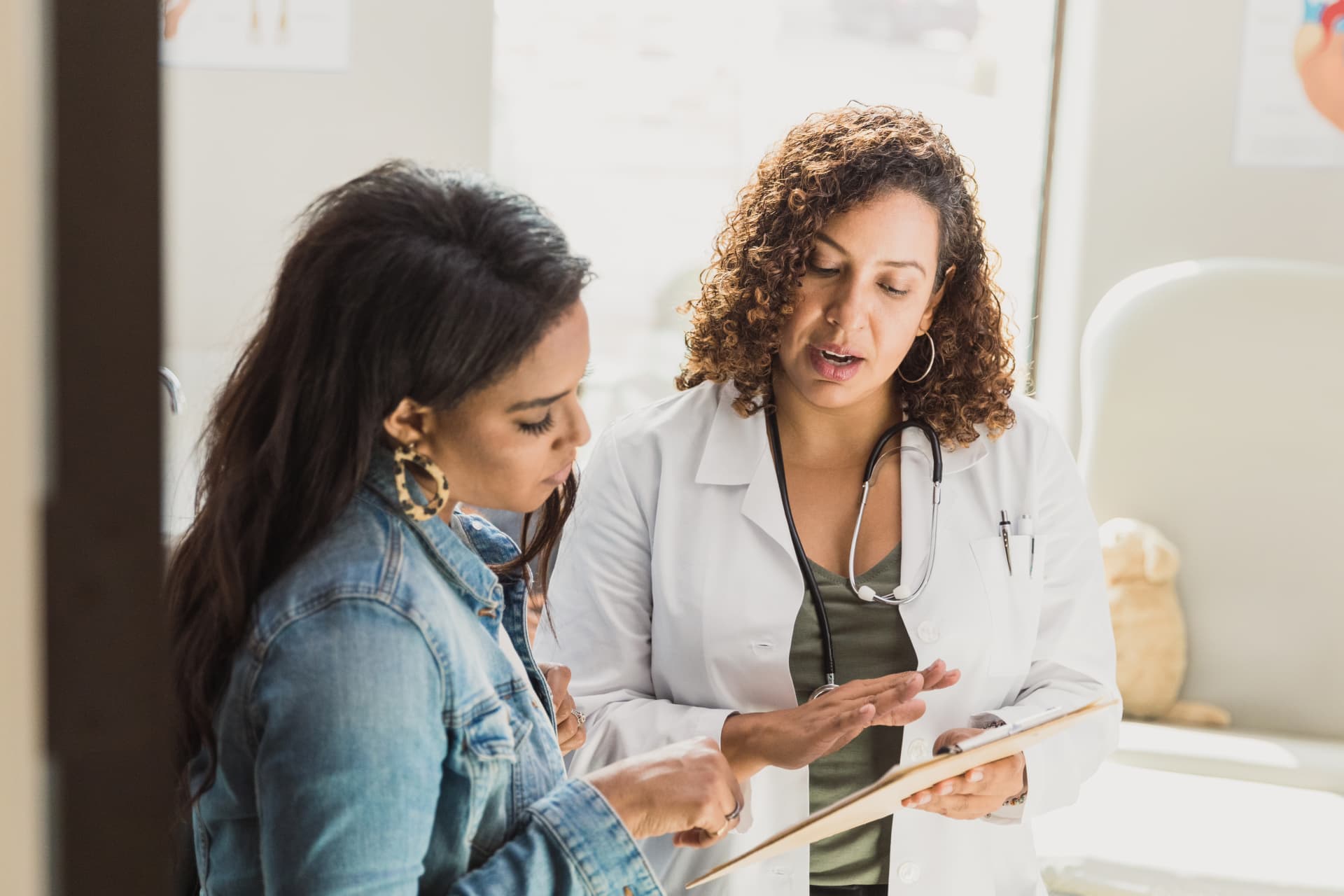 physician talking to a woman