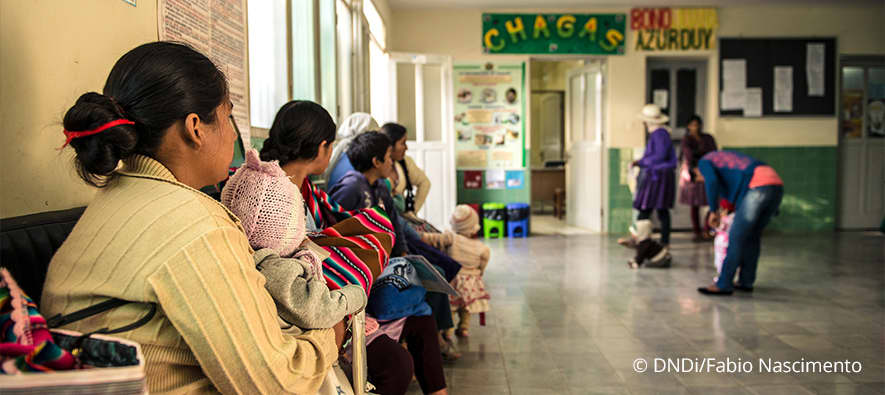 Five people sitting down and six people standing up in waiting room