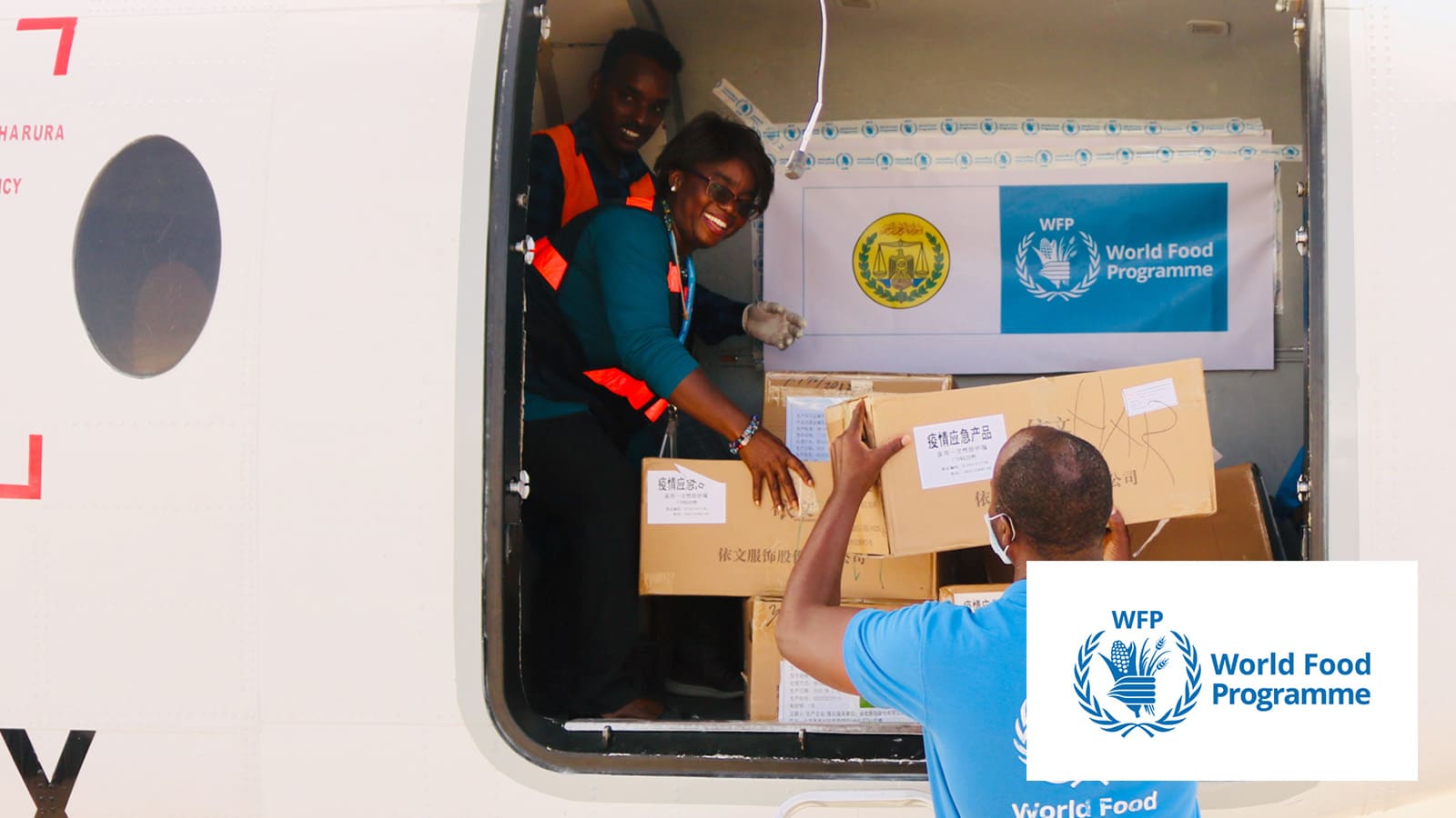 health workers unloading a truck with supplies