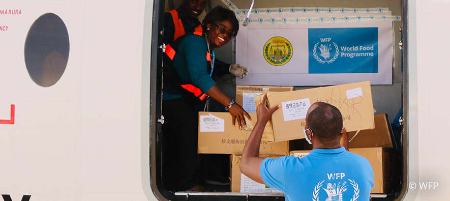 health workers unloading a truck with supplies