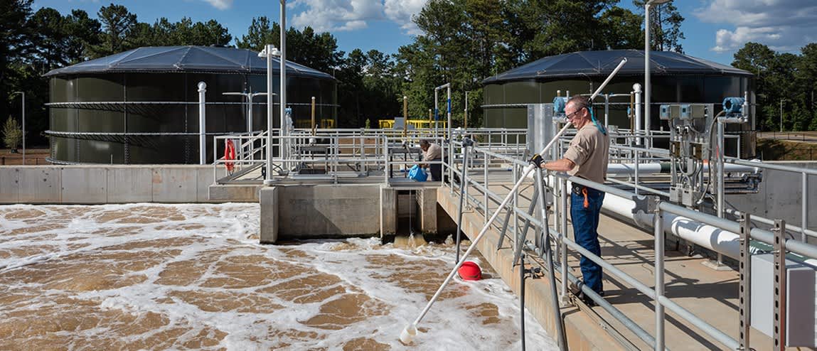 Man working at water recycling plant