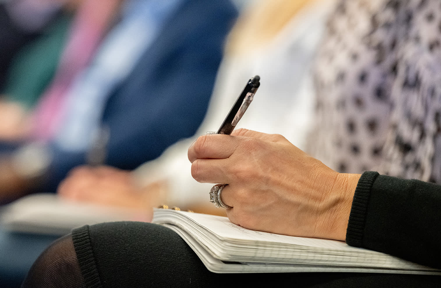 a hand taking notes