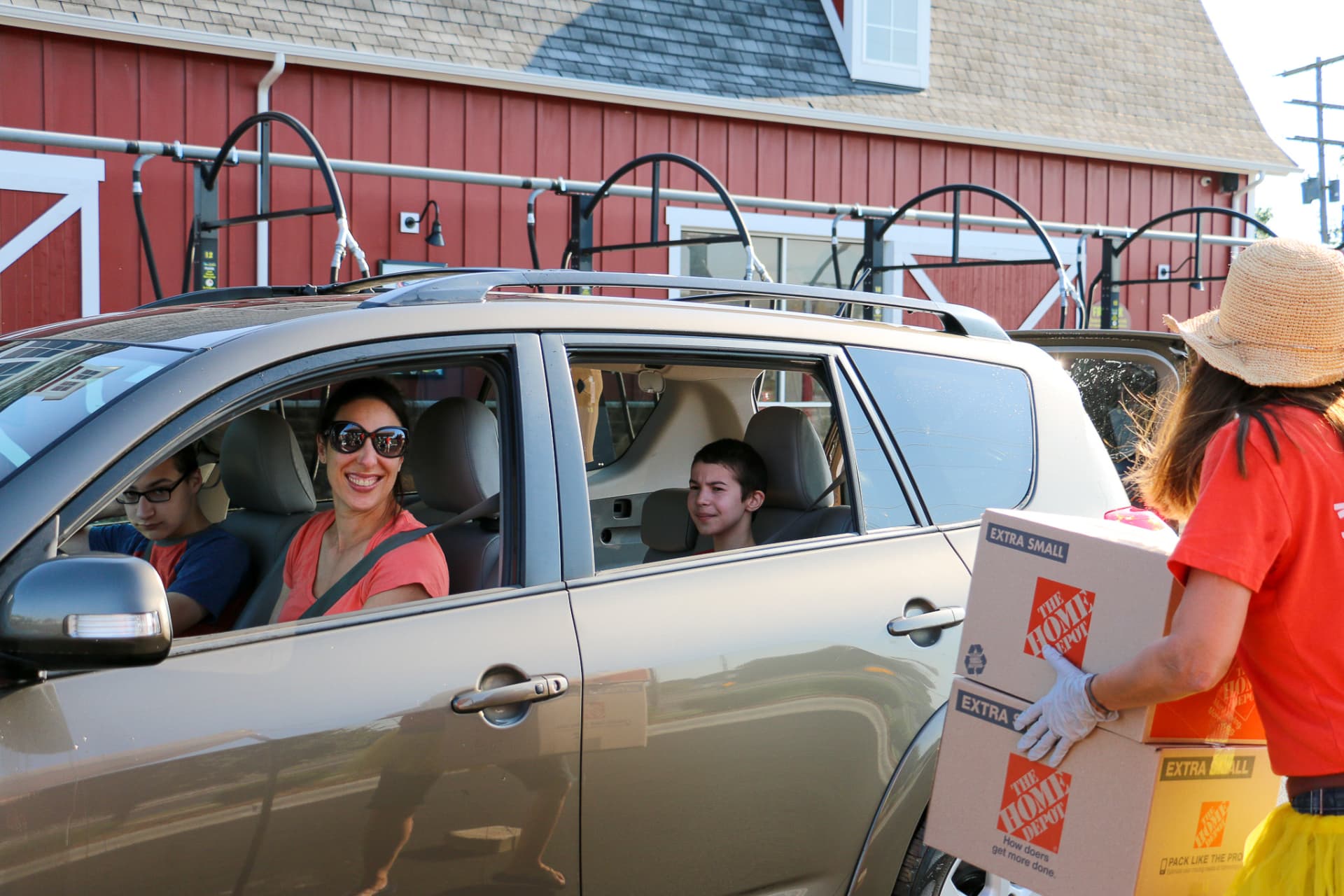 Family in van receiving boxes