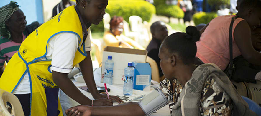 healthcare professional measuring blood pressure of a women