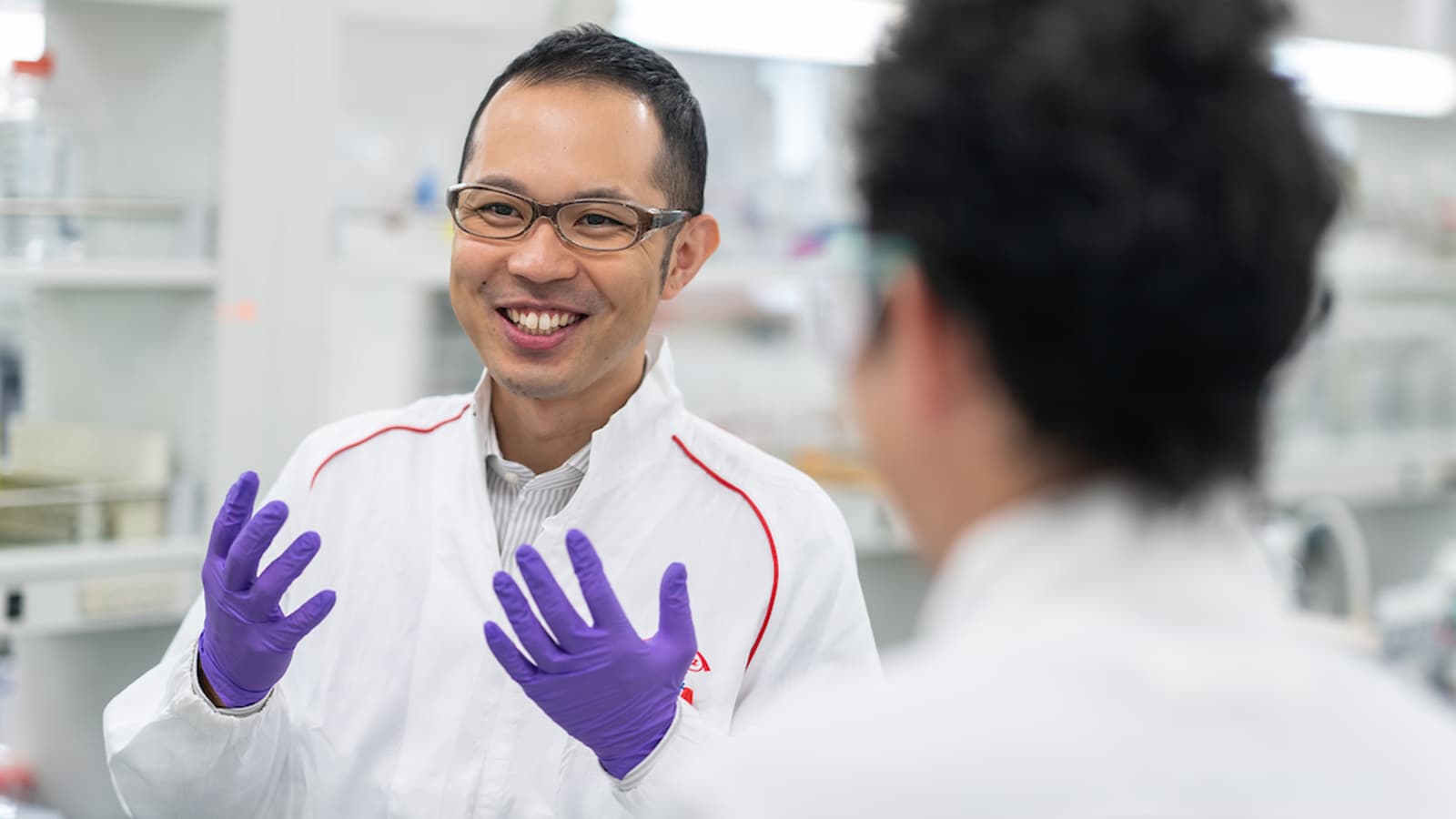 employee smiling in a lab