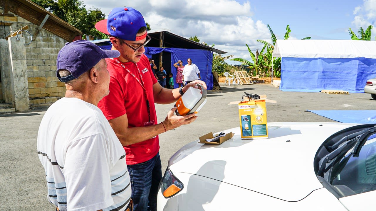 Two men reviewing supplies