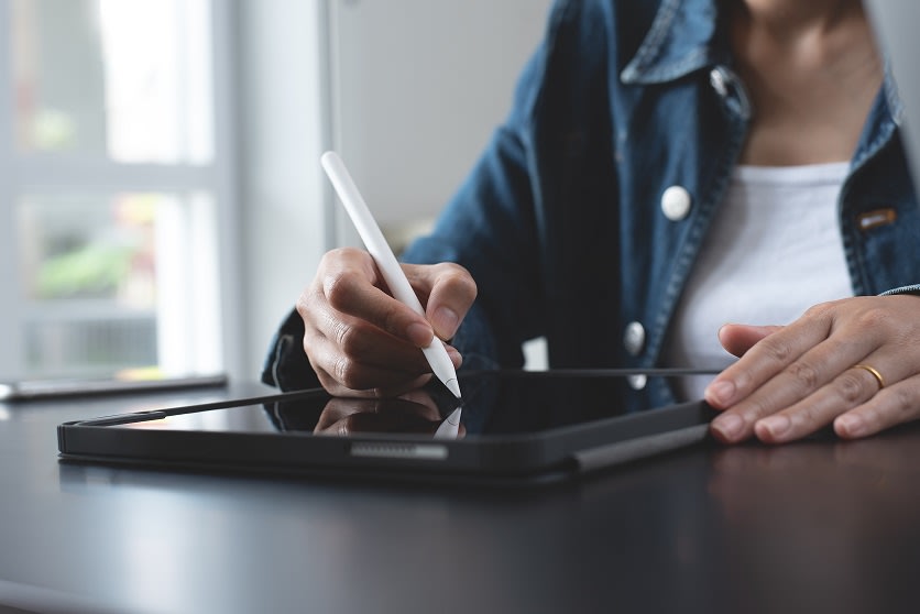 person writing on table