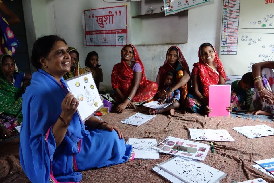 group of women sitting in circle 