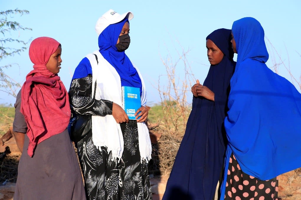 group of four women speaking