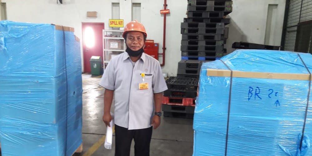 man standing in storage room