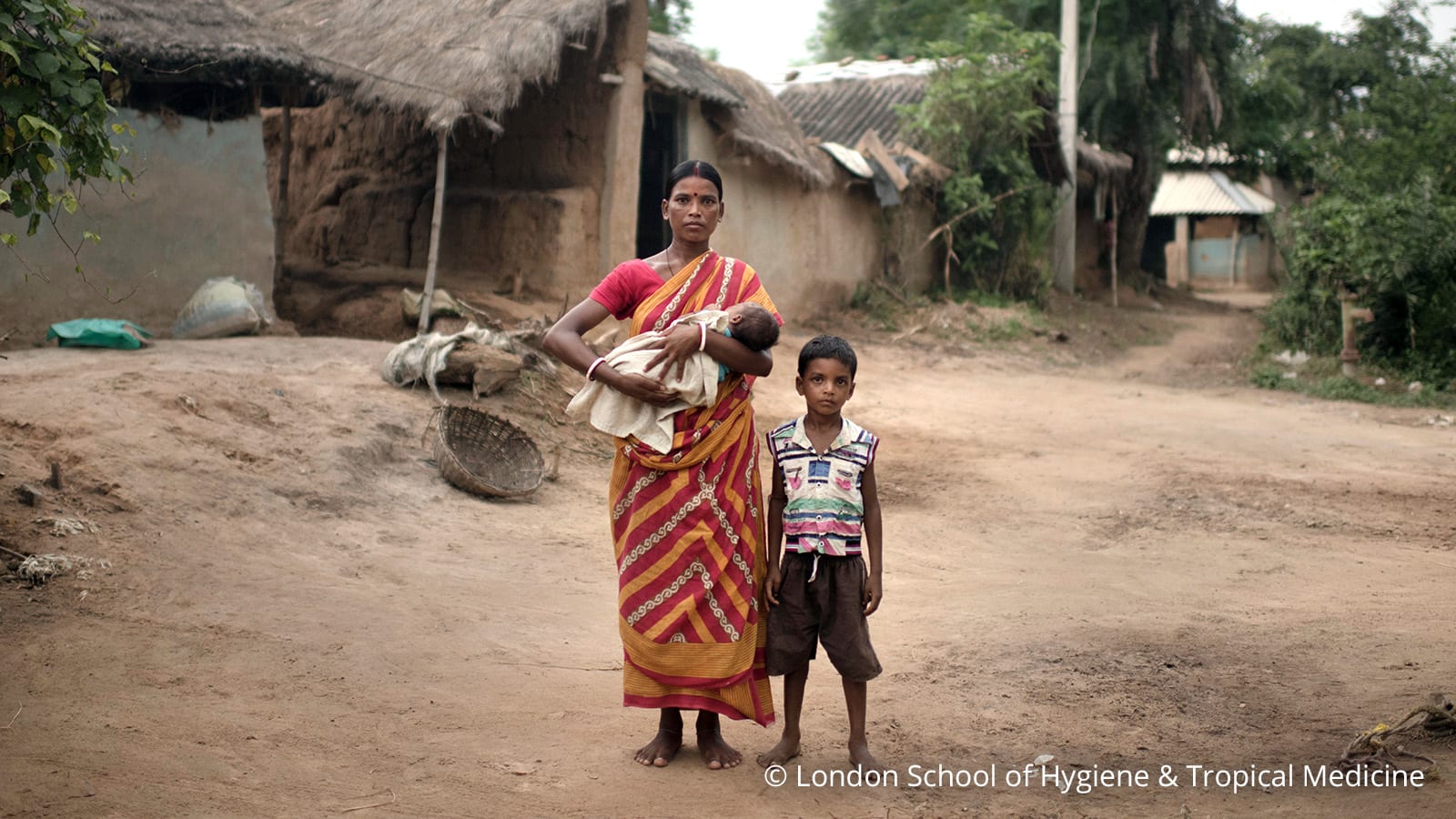 mother carrying baby. Kid on her side