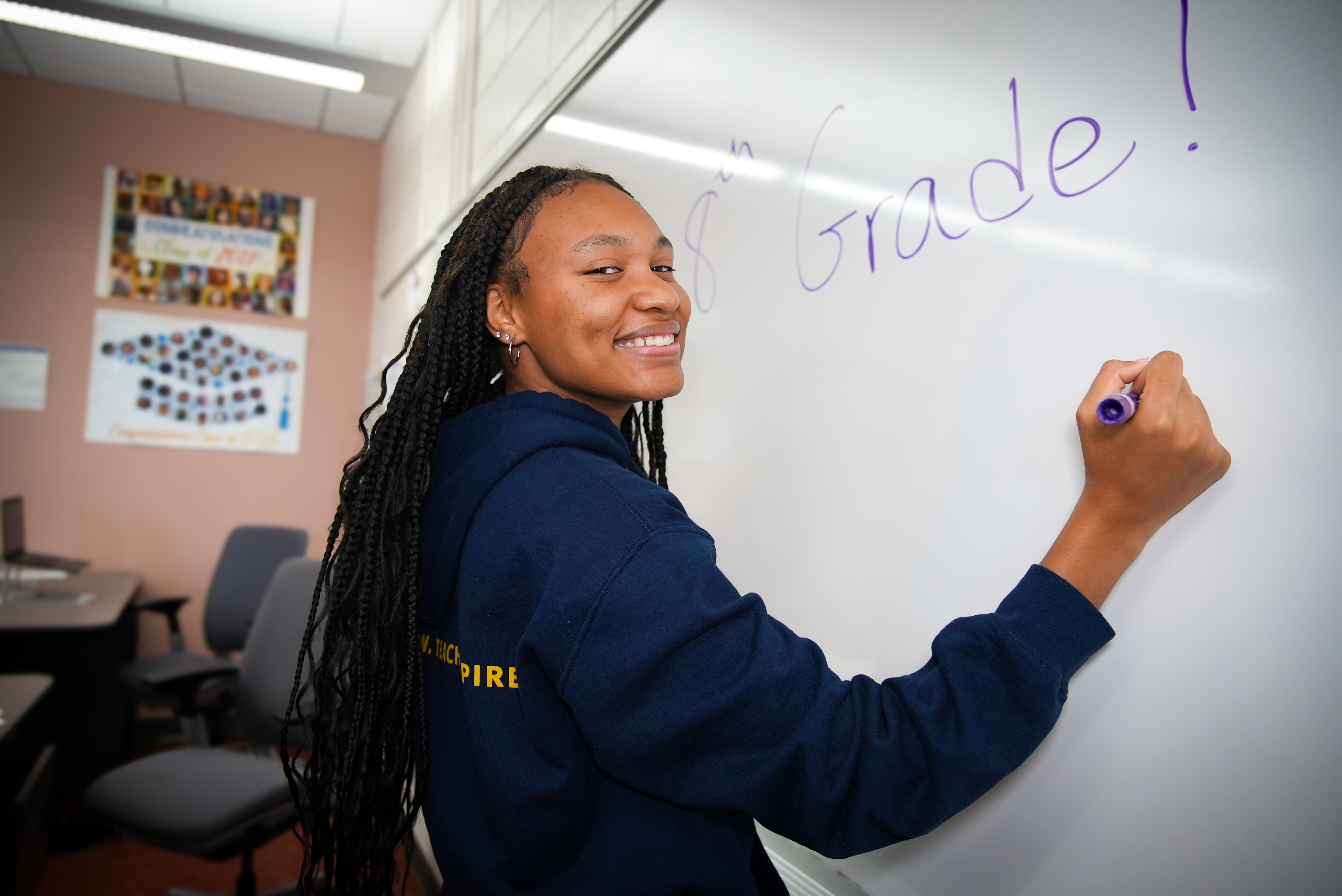 Kyla Harris writing in chalkboard