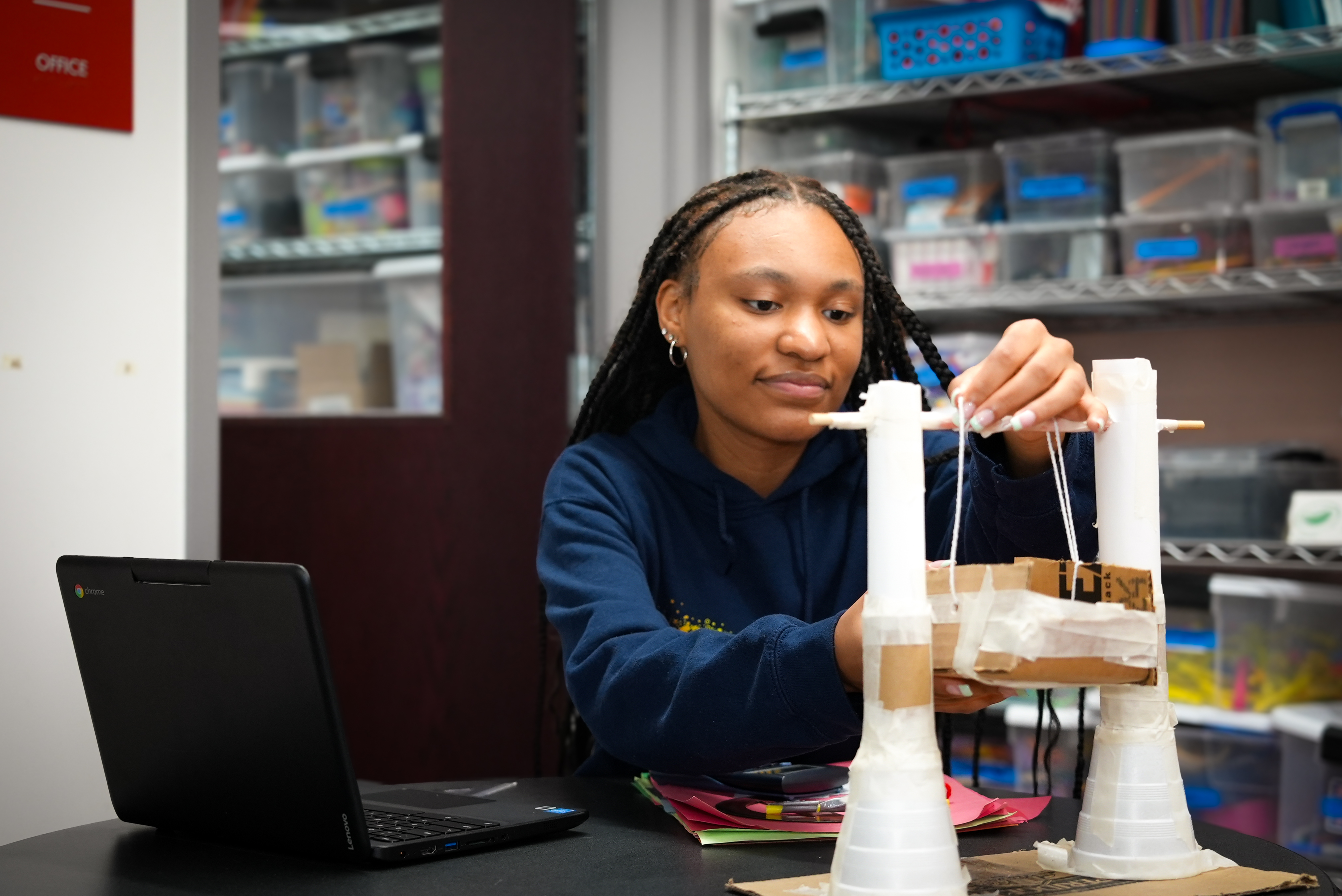 Kyla Harris fine-tunes a physics project inside the Breakthrough Greater Boston office